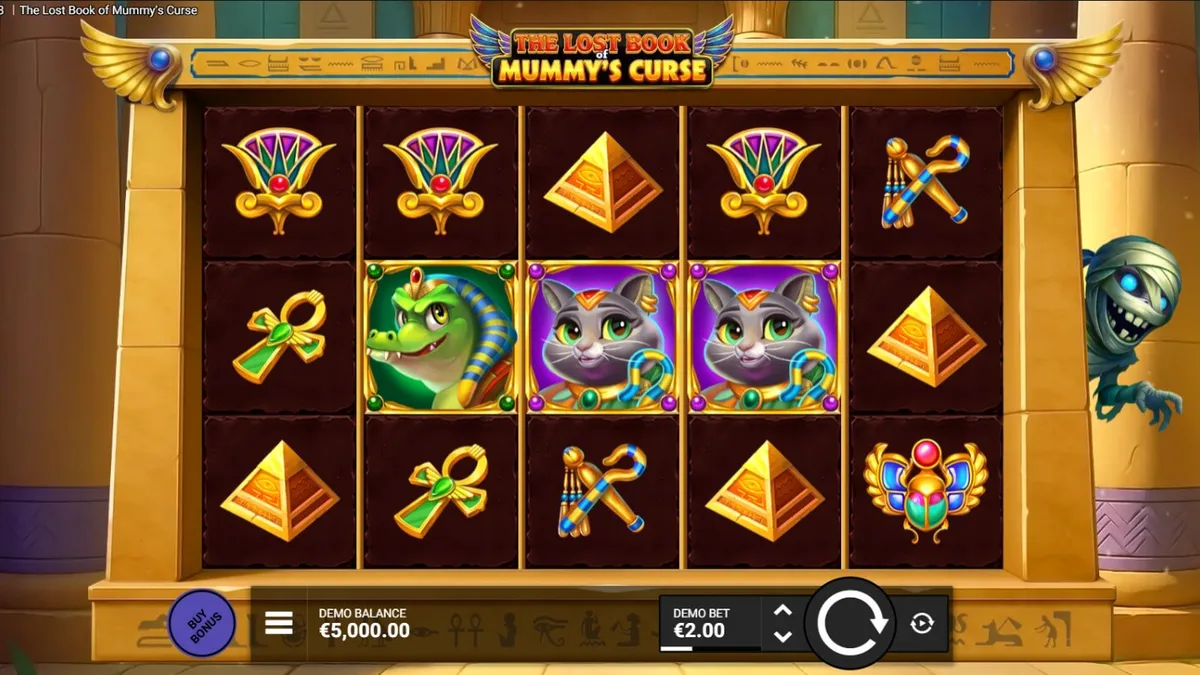 Tampilan visual slot The Lost Book of Mummy’s Curse dengan maskot mumi kartun